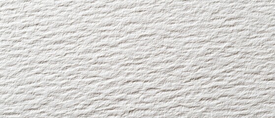 Close-up view of a textured, light gray fabric or paper