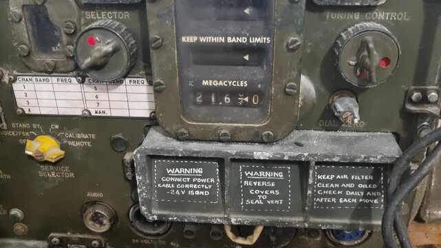 Close-up of a historical military radio used by Greek forces against Germany in WWII, filmed inside a preserved bunker in Northern Greece