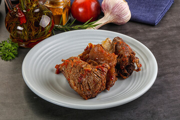 Baked beef ribs with vegetables