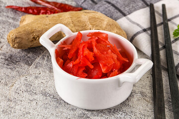 Marinated ginger root in the bowl