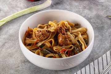 Asian cuisine udon with chicken and vegetables
