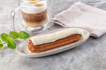 White vanilla eclair with icing
