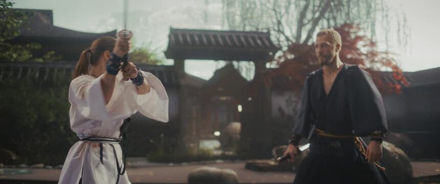 Cinematic Martial Arts Fight in Slow Motion Close Up Footage. Woman and a Man in Traditional Clothing, Filmed Outdoors. Japanese Scene Captures a Moment of Intense Rivalry and Theater