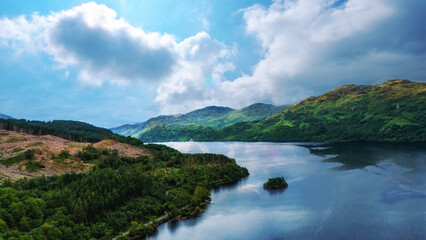 A view of Loch Lomond in Scotland on a sunny day.