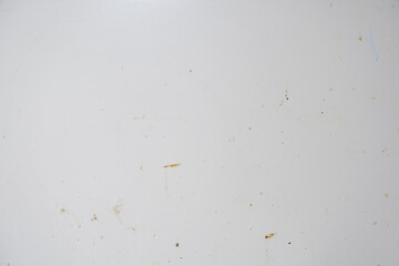 ざらざらの古い汚い壁のテクスチャー背景壁紙　凸凹の質感　傷ついた表面と張り付けたテープのあとの汚れ　アンティーク・ビンテージ