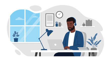 Focused Black man working remotely on a laptop in a modern home office with headphones. Represents productivity, remote work, and online education.