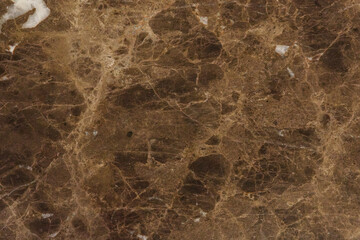 淡い茶色地に白いうねり模様が入るダイナミックな柄が特徴の大理石のテクスチャー背景　