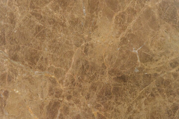 淡い茶色地に白いうねり模様が入るダイナミックな柄が特徴の大理石のテクスチャー背景　