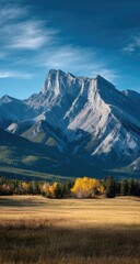 Obraz premium Majestic mountain range, autumnal meadow
