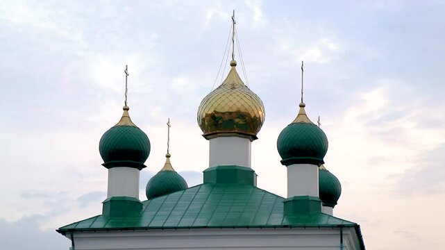 Green and white church cathedral with golden dome Mir Belarus.
