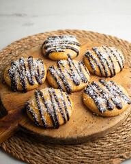 Butter and coconut cookies decorated with chocolate and grated coconut.