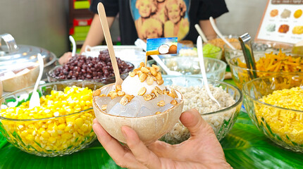Coconut ice cream, refreshing and fragrant, a popular street food in Thailand.