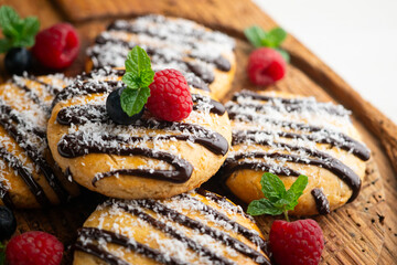 Butter and coconut cookies decorated with chocolate and grated coconut.