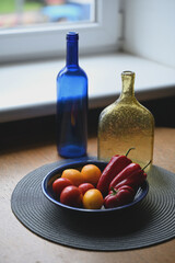 still life with bottles of pepper and tomatoes