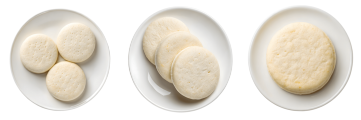 Three plates with sugar cookies are arranged on a transparent background