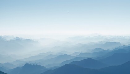 Fototapeta premium Hazy mountain range with layered peaks receding into the distance, creating a sense of depth and atmospheric perspective