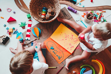 Naklejka premium Kids draw and make crafts. Kindergarten or preschool background.