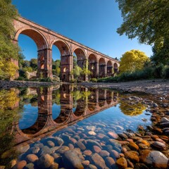 Obraz premium Rustic stone bridge reflected in clear shallows