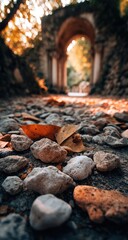 Autumnal pathway through a stone archway