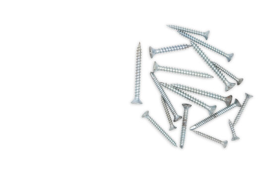 Many silver screws scattered on white.