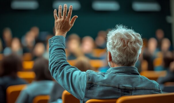 back view of an older student raising their hand to answer the teachers question during an educational training class. The image emphasizes lifelong learning and active participation, Generative AI