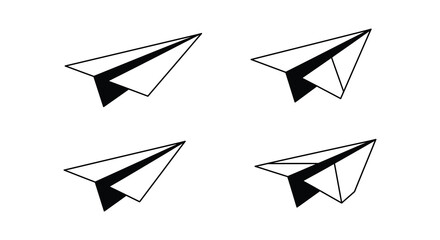 Four black and white paper airplanes flying in different directions