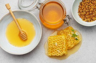 Composition of honey, honeycombs and bee pollen creating delicious golden spread