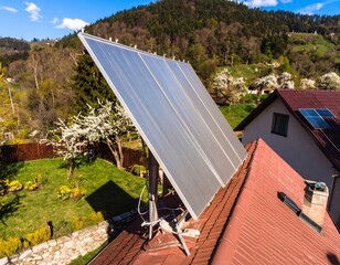 Solar Panels Installed on House Roof, Hillside View