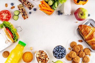 Preparing homemade balanced healthy lunch box for schooler