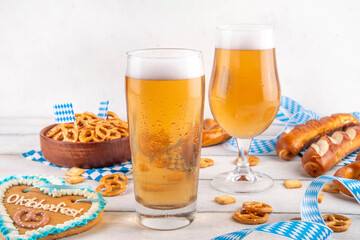 Oktoberfest holiday background with beer glasses, salted snack and pretzels