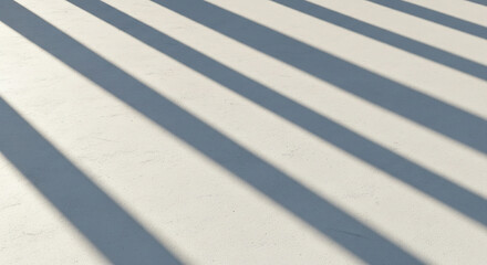 Fototapeta premium A minimalist abstract background of long, diagonal shadows from bright sun on a concrete floor.