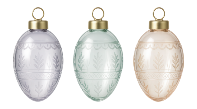Miniature glass egg ornaments with intricate designs, intended for decorating a small Easter tree on a kitchen counter.