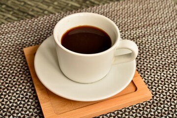 Black coffee on a table — a comforting part of the morning ritual.