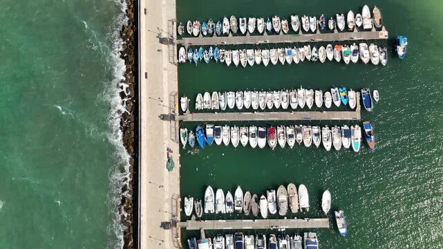 Aerial drone view of Torre a Mare in Puglia, southern Italy, showcasing the scenic coastline, marina with moored boats