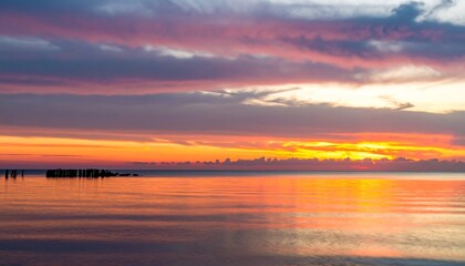 Naklejka premium Calm morning fire sky water