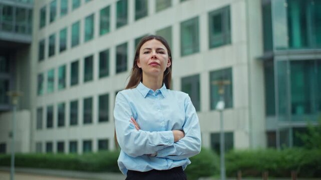 Portrait of businesswoman in Courbevoie Paris business center. Woman rushes to work in glass skyscraper office, finance and business.