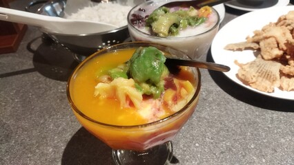 Delicious Indonesian Mango and Avocado Dessert with Crispy Fried Snacks