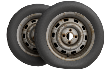 Close-up of a pair of used tires mounted on weathered steel rims showing significant surface rust and wear.  The tires appear dark gray and slightly worn