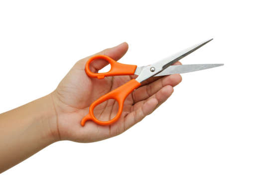 Hand holding scissors close up studio shot of orange handled scissors on transparent background