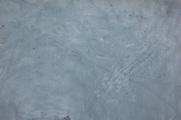 Worn gray painted metal with scuffs and various dirt