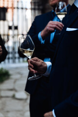man holding a glass of wine