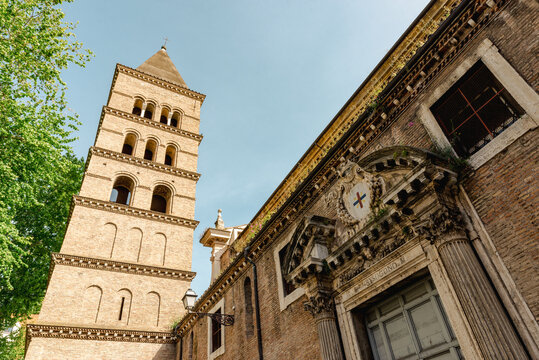 San Sisto Vecchio church in Rome, Italy, with its medieval brick bell tower and ornate entrance