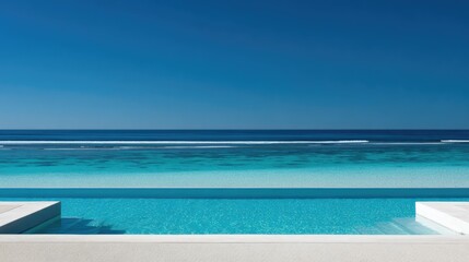 Tranquil Infinity Pool Overlooking Crystal Clear Ocean and Clear Blue Sky in Tropical Paradise