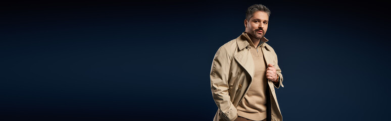 Handsome man showcases trendy outfit in modern studio setting