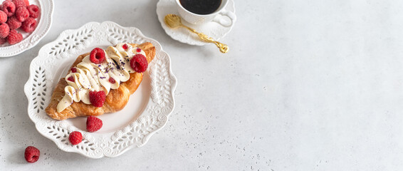 Trendy flat croissant on white plate, coffee banner. Delicious buttery thin croissant with fresh raspberry, cream. Viral Crusty flat croissant recipe, bakery, cafe web line menu, top view, copy space