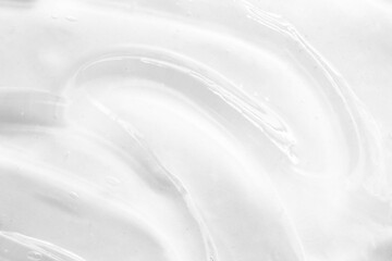 Cosmetic gel, serum transparent sample. Liquid cream with bubble texture. Gel texture of a cosmetic product. Clear liquid lotion for skin care.