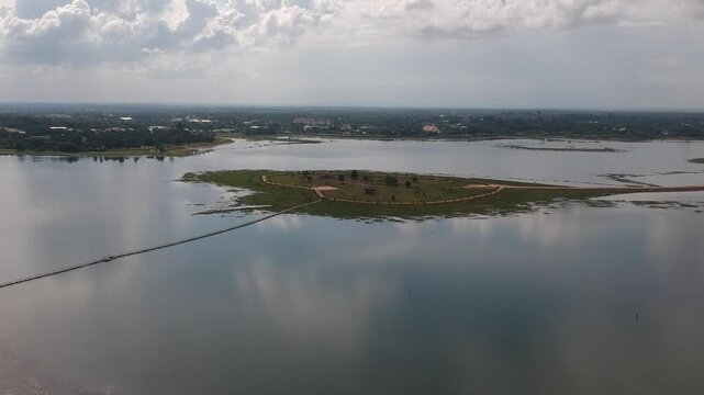 Aerial Drone View of Phutthachai Reservoir at Buddhist Park, Amnat Charoen, Thailand, Perfect for travel, tourism, cultural, and documentary projects.