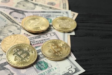Metal shiny bitcoin crypto currency coins on US dollar bills. Electronic decentralized money concept. 