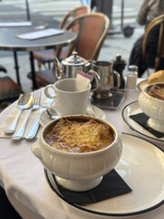 Tasty french onion soup on the table in cafe