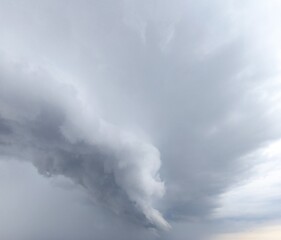 A huge thundercloud. A storm at sea. Dark clouds sky. Dramatic stormy dark cloudy sky over sea, natural photo background